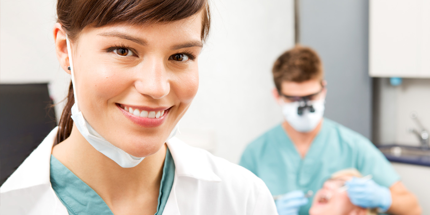 Clinical Dental Assistant working in a dentist's office